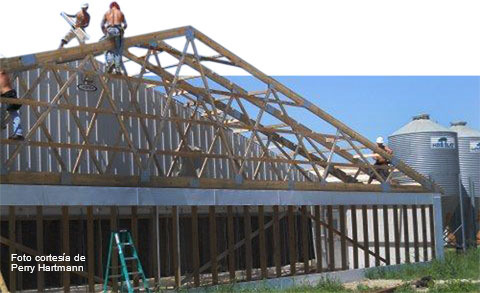 Construction work on a sow facility. Retrofitting an existing structure with a bank of air filter panels for a tunnel ventilated system. Picture courtesy by Perry Hartmann